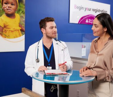 Blood donor reviewing eligibility with a CTBC doctor.